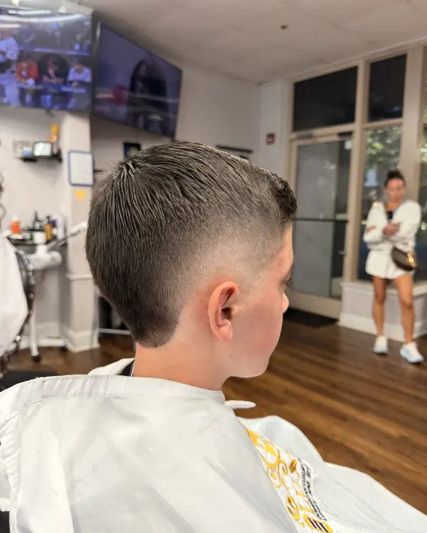 Boy's taper haircut, side view