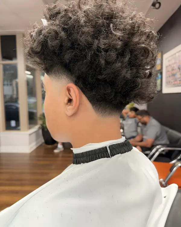 Curly top with a taper fade