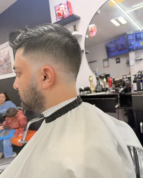 Skin fade with a sharp beard line