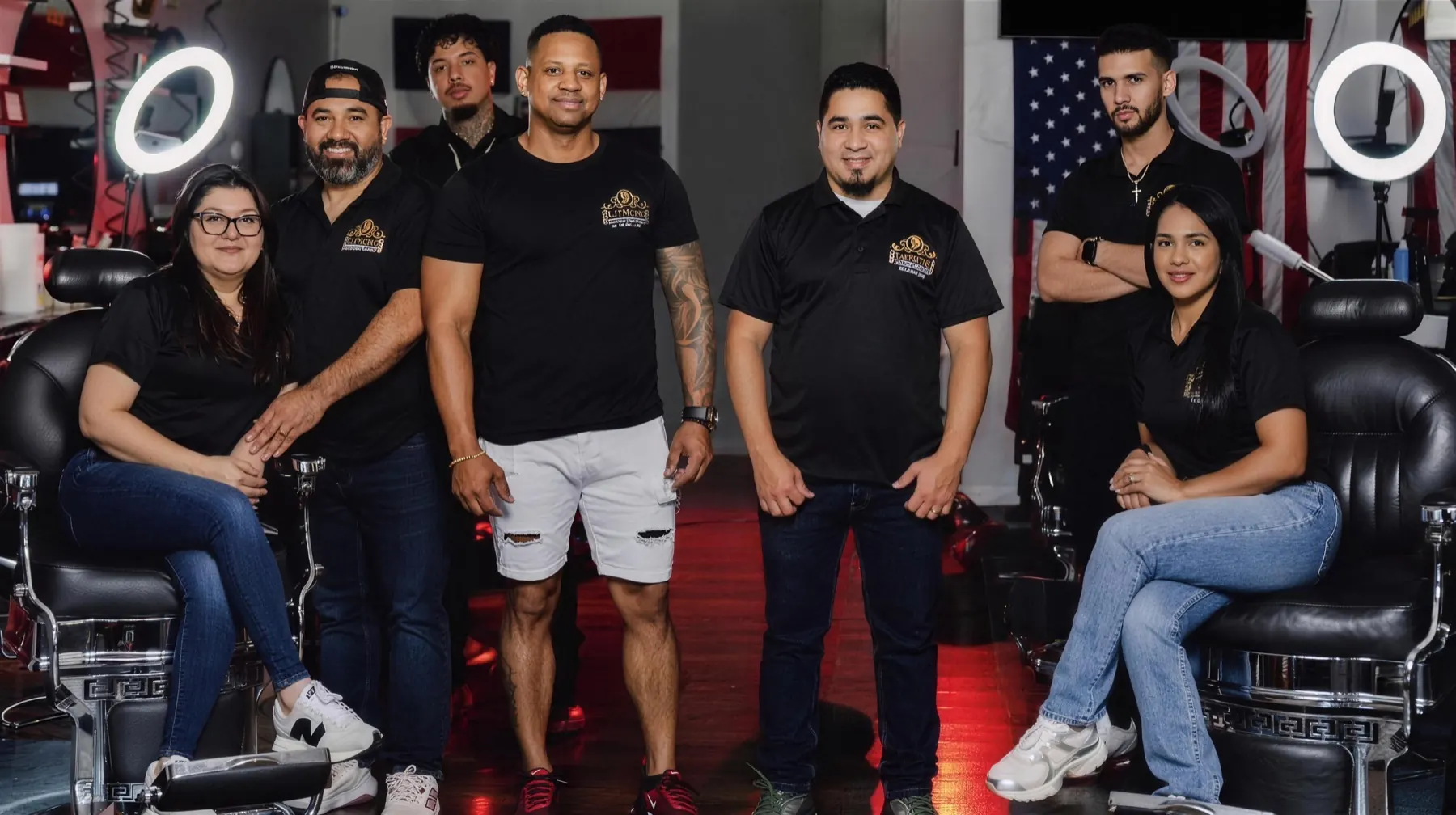 The Dominican Luxury Barbers crew together in the shop